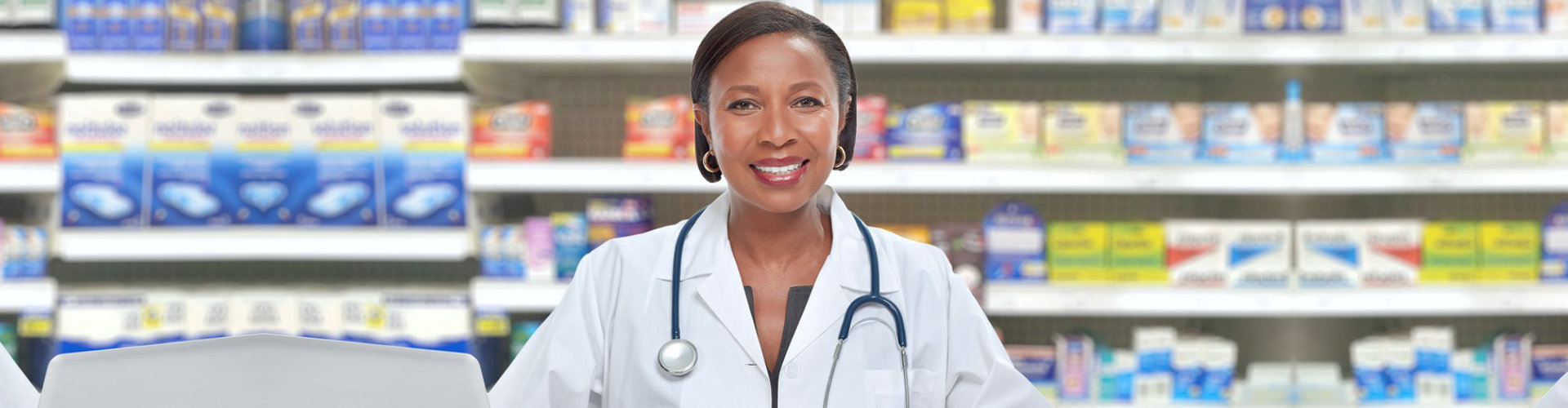 a pharmacist smiling at the camera